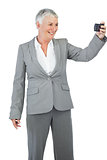 Businesswoman taking picture of herself