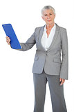 Businesswoman holding her clipboard and looking at camera