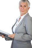 Serious businesswoman holding notepad