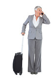 Businesswoman calling and has luggage