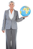 Businesswoman holding globe