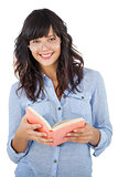 Young woman wearing glasses and holding book