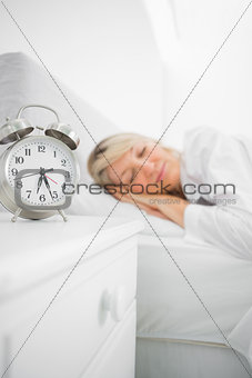 Blonde woman asleep in bed