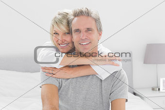 Loving couple smiling at camera