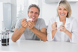 Happy couple having coffee in the morning