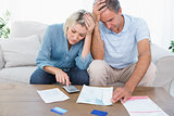 Worried couple going over finances