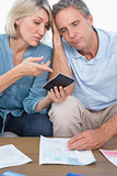 Anxious couple going over their debt