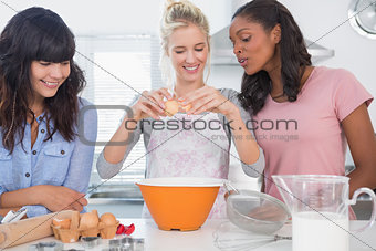 Cheerful friends making pastry together