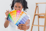 Excited woman showing colour charts