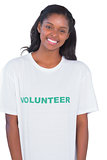 Smiling young woman wearing volunteer tshirt