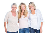 Three generations of women smiling at camera
