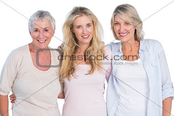 Three generations of  happy women smiling at camera