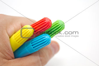 Hand holding pens