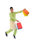 Traditional Malay male shopping and jumping in joy during hari 