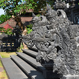 Traditional Balinese stone dragon image in the temple