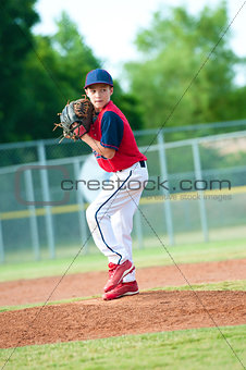 Young boy baseball pitcher