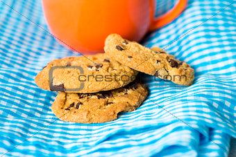 Chocolate chips cookies with a drink 