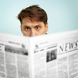 Man reads news in the newspaper