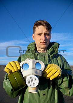 Man in a overalls with a gas mask