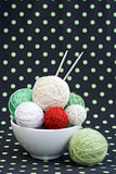 A lot of bright balls for knitting on a dark background