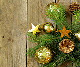 Christmas green fir tree  branches with beautiful decorations on wooden background