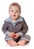 Small baby holding red apple