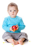 Small baby holding red apple