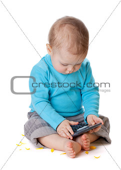 Small baby playing with calculator
