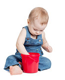 Small baby with toy bucket