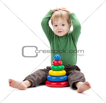 Small baby with a toy pyramid