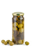 Glass jar with green and black olives