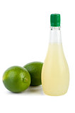 Two limes and bottle of juice