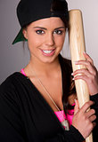 Pretty Female Baseball Lover Holds A Wooden Bat and Smiles