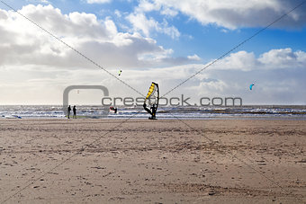 kitesurfer on sand beach at North sea