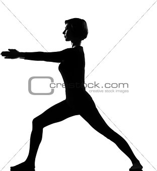 woman virabhadrasana 2 warrior exercising fitness yoga stretchin
