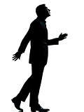 one business man walking looking up silhouette