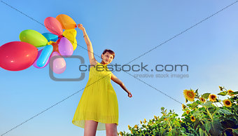 girl playing with balloons 