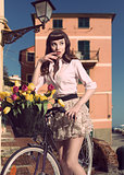 sensual girl posing near bicycle outdoor