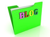 BLOG bright letters on a green folder with papers
