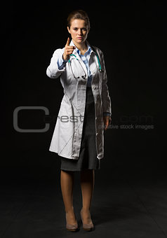 Full length portrait of doctor woman threatening with finger iso