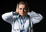 Portrait of doctor woman showing hear no evil gesture isolated o