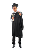 Asian male university student in graduation gown thumb up 