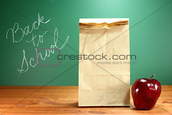 School Lunch Sack Sitting on Teacher Desk