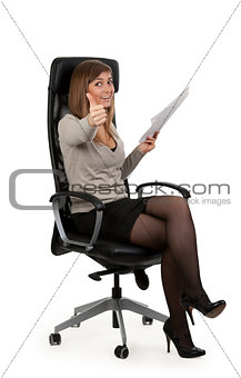 beautiful girl is sitting in an office chair