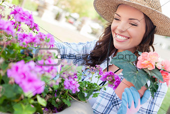 Young Adult Woman Wearing Hat Gardening Outdoors