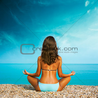 Woman Doing Yoga at the Sea