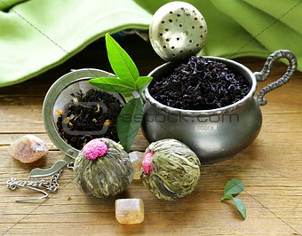 assortment of tea - black leaf, green, exotic and tea strainers