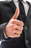 Business man showing a thumbs up sign