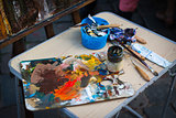 palette with paintbrush and palette-knife 