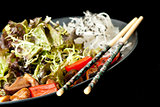 Healthy Japanese salad on the black plate